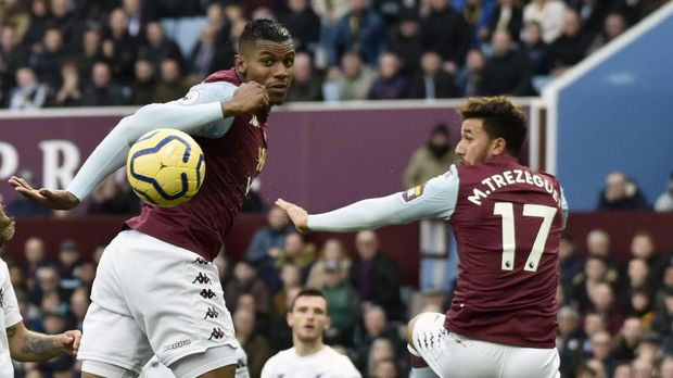 Aston Villa's Wesley, left, heads the ball during the English Premier League soccer match between Aston Villa and Liverpool at Villa Park in Birmingham, England, Saturday, Nov. 2, 2019. (AP Photo/Rui Vieira)