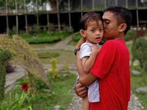 father with his girl suffering from cerebral palsy father with his girl suffering from cerebral palsy