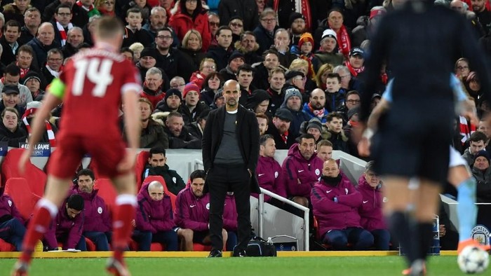 Manchester Citys Spanish manager Pep Guardiola gestures during the UEFA Champions League first leg quarter-final football match between Liverpool and Manchester City, at Anfield stadium in Liverpool, north west England on April 4, 2018. (Photo by Anthony Devlin / AFP)