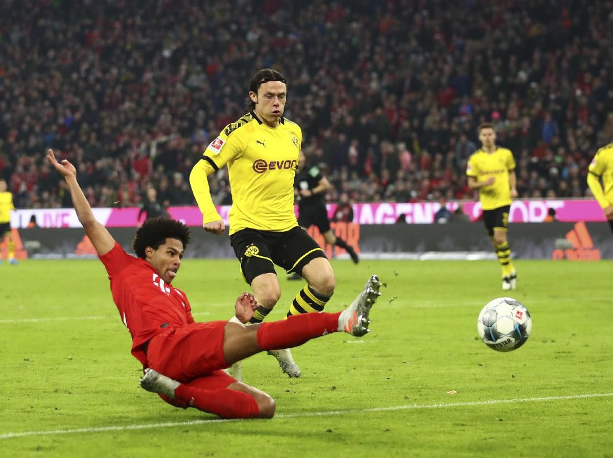 Borussia Dortmund vs Bayern Munich di Liga Jerman pekan ke-28. (Foto: AP Photo/Matthias Schrader)