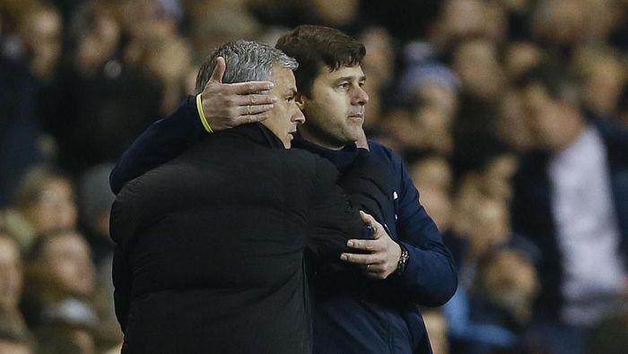 Jose Mourinho-Mauricio Pochettino FILE - In this Thursday, Jan. 1, 2015 file photo Tottenham manager Mauricio Pochettino, right, embraces Chelsea manager Jose Mourinho at the end of the English Premier League soccer match between Tottenham Hotspur and Chelsea at White Hart Lane Stadium in London. Jose Mourinho sealed a return to coaching after almost a year out when he was hired as Tottenham manager on Wednesday Nov. 20, 2019 a day after the Premier League club fired Mauricio Pochettino. (AP Photo/Kirsty Wigglesworth, File)