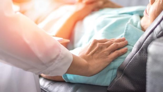 Caregiver, carer hand holding elder hand woman in hospice care. Philanthropy kindness to disabled concept.Public Service Recognition Week