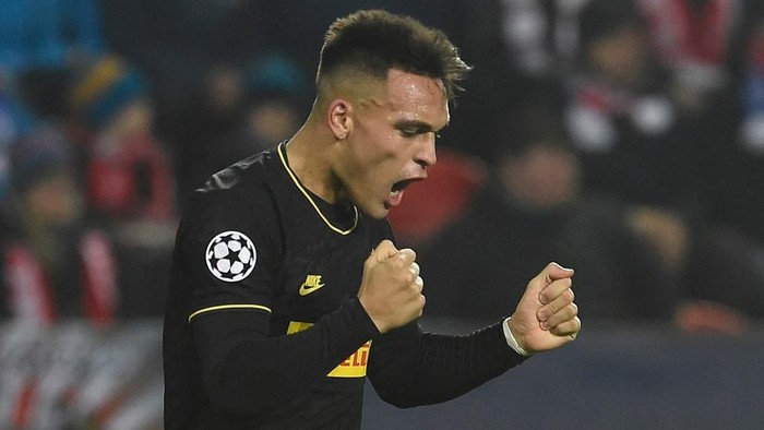 Inter Milans Argentinian forward Lautaro Martinez celebrates scoring the opening goal during the UEFA Champions League football match SK Slavia Prague v Inter Milan in Prague, Czech Republic on November 27, 2019. (Photo by Michal CIZEK / AFP)