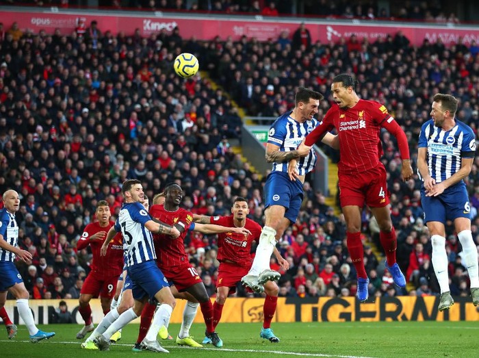 LIVERPOOL, ENGLAND - NOVEMBER 30:  Virgil van Dijk (R) of Liverpool scores his teams second goal with header during the Premier League match between Liverpool FC and Brighton & Hove Albion at Anfield on November 30, 2019 in Liverpool, United Kingdom. (Photo by Clive Brunskill/Getty Images)