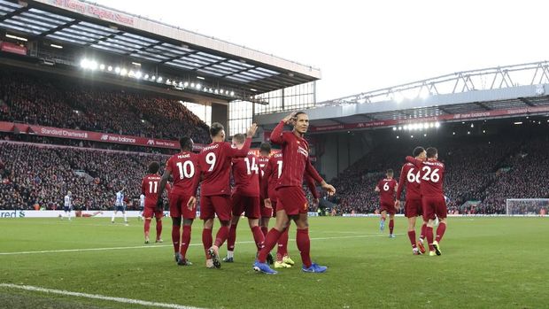 Liverpool vs Brighton Liverpool's Virgil van Dijk centre right celebrates after scoring his second goal during the English Premier League soccer match between Liverpool and Brighton at Anfield Stadium, Liverpool, England, Saturday, Nov. 30, 2019. (AP Photo/Jon Super)
