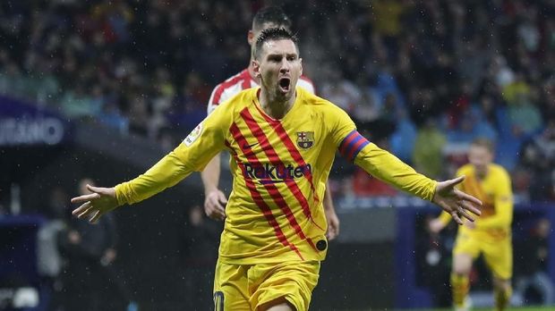 FC Barcelona's Lionel Messi celebrates after scoring his opening goal during a Spanish La Liga soccer match between Atletico Madrid and FC Barcelona at Wanda Metropolitano stadium in Madrid, Spain, Sunday, Dec. 1, 2019. (AP Photo/Manu Fernandez)