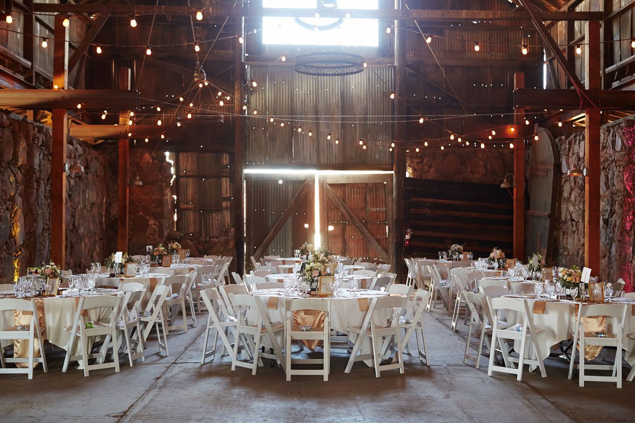 Outdoor wedding ceremony venue with arch and decoration