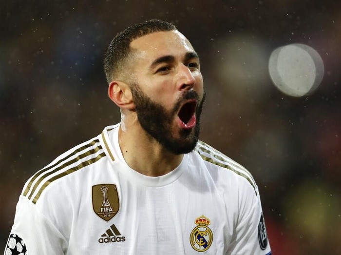 Real Madrid's Karim Benzema celebrates after scoring his side's opening goal during a Champions League soccer match Group A between Real Madrid and Paris Saint Germain at the Santiago Bernabeu stadium in Madrid, Spain, Tuesday, Nov. 26, 2019. (AP Photo/Manu Fernandez)