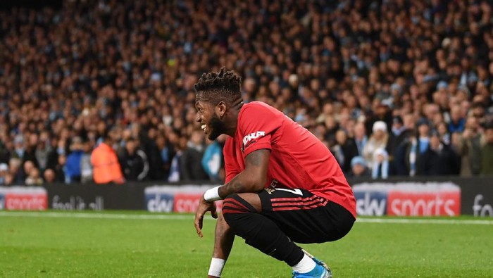 MANCHESTER, ENGLAND - DECEMBER 07: Fred of Manchester United reacts after being hit by a lighter thrown from the crowd during the Premier League match between Manchester City and Manchester United at Etihad Stadium on December 07, 2019 in Manchester, United Kingdom. (Photo by Laurence Griffiths/Getty Images)