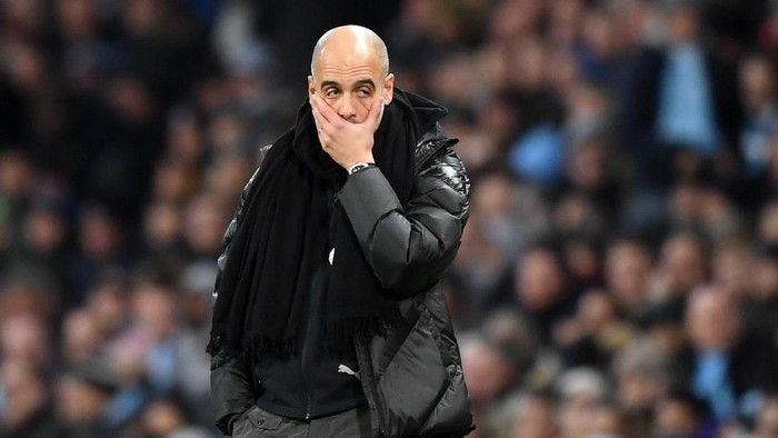 MANCHESTER, ENGLAND - DECEMBER 07: Pep Guardiola, Manager of Manchester City recats during the Premier League match between Manchester City and Manchester United at Etihad Stadium on December 07, 2019 in Manchester, United Kingdom. (Photo by Michael Regan/Getty Images)