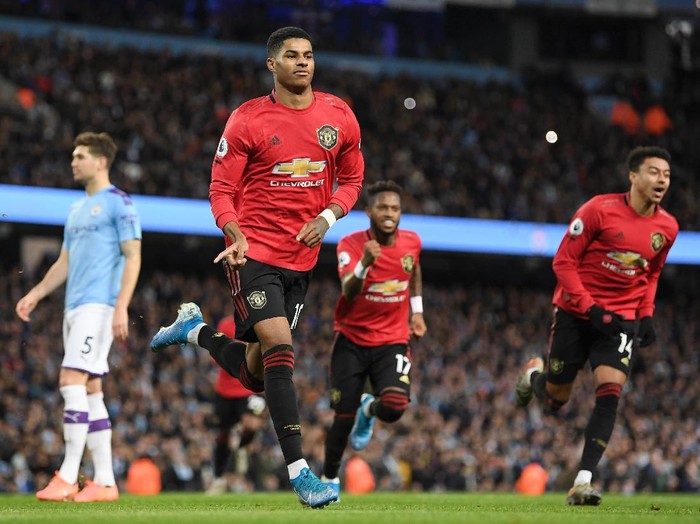 MANCHESTER, ENGLAND - DECEMBER 07: Marcus Rashford of Manchester United celebrates after scoring his teams first goal during the Premier League match between Manchester City and Manchester United at Etihad Stadium on December 07, 2019 in Manchester, United Kingdom. (Photo by Michael Regan/Getty Images)