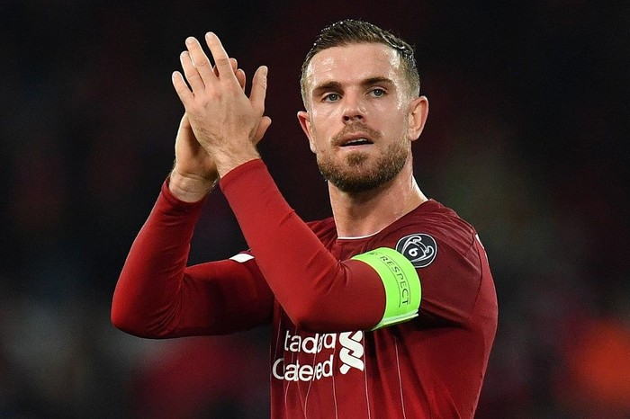 Liverpools English midfielder Jordan Henderson applauds the fans following the UEFA Champions league Group E football match between Liverpool and Napoli at Anfield in Liverpool, north west England on November 27, 2019. - The match ended in a draw at 1-1. (Photo by Paul ELLIS / AFP)