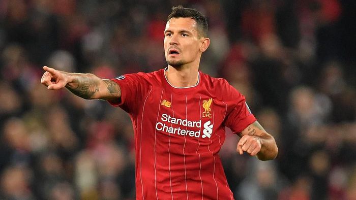 Liverpools Croatian defender Dejan Lovren celebrates scoring equalising goal during the UEFA Champions league Group E football match between Liverpool and Napoli at Anfield in Liverpool, north west England on November 27, 2019. (Photo by Paul ELLIS / AFP)