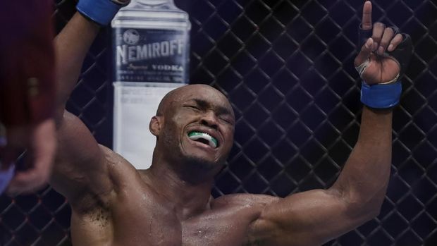 LAS VEGAS, NEVADA - MARCH 02: Kamaru Usman, of Nigeria, celebrates after defeating Tyron Woodley in a welterweight title bout during UFC 235 at T-Mobile Arena on March 02, 2019 in Las Vegas, Nevada. Usman won by unanimous decision.   Isaac Brekken/Getty Images/AFP