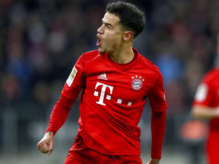 Bayern's Philippe Coutinho celebrates after scoring his side's third goal during the German Bundesliga soccer match between FC Bayern Munich and SV Werder Bremen in Munich, Germany, Saturday, Dec. 14, 2019. (AP Photo/Matthias Schrader)