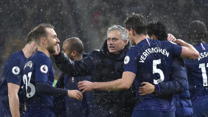 Tottenhams manager Jose Mourinho, centre, celebrates with his players at the end of the the English Premier League soccer match between Wolverhampton Wanderers and Tottenham Hotspur at the Molineux Stadium in Wolverhampton, England, Sunday, Dec. 15, 2019. (AP Photo/Rui Vieira)