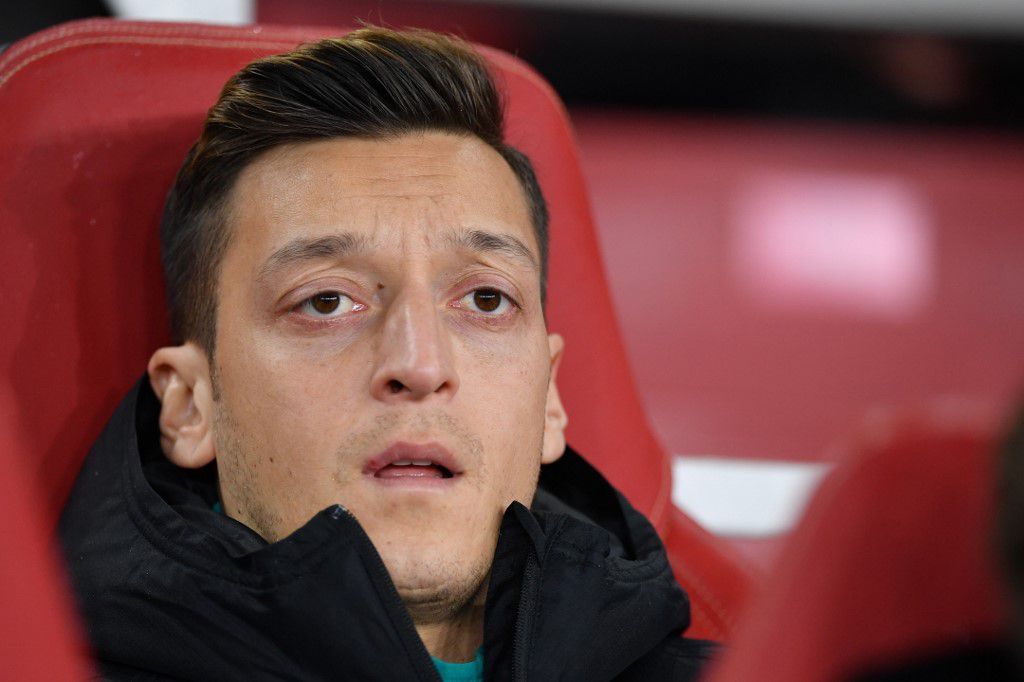 Arsenal's German midfielder Mesut Ozil looks on from the bench during their UEFA Europa league Group F football match between Arsenal and Eintracht Frankfurt at the Emirates stadium in London on November 28, 2019. (Photo by DANIEL LEAL-OLIVAS / AFP)