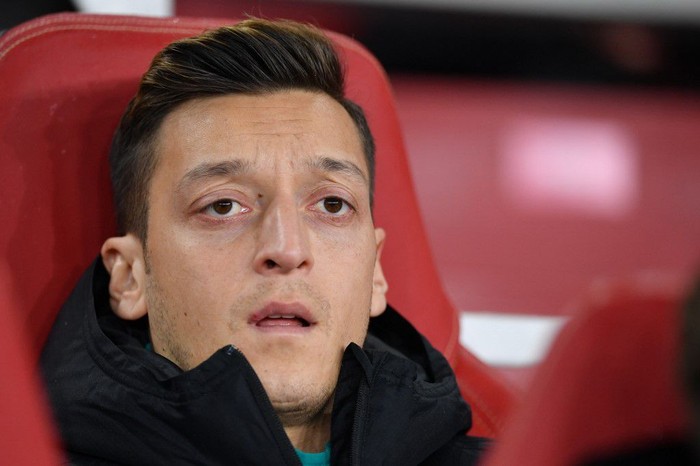 Arsenals German midfielder Mesut Ozil looks on from the bench during their UEFA Europa league Group F football match between Arsenal and Eintracht Frankfurt at the Emirates stadium in London on November 28, 2019. (Photo by DANIEL LEAL-OLIVAS / AFP)