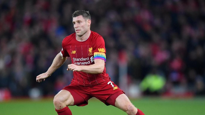 LIVERPOOL, ENGLAND - DECEMBER 04: James Milner of Liverpool runs with the ball during the Premier League match between Liverpool FC and Everton FC at Anfield on December 04, 2019 in Liverpool, United Kingdom. (Photo by Laurence Griffiths/Getty Images)