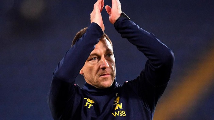 LONDON, ENGLAND - DECEMBER 04: John Terry, Assistant Head Coach of Aston Villa acknowledges the fans during the warm up prior to the Premier League match between Chelsea FC and Aston Villa at Stamford Bridge on December 04, 2019 in London, United Kingdom. (Photo by Justin Setterfield/Getty Images)
