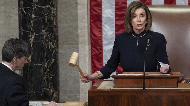 US Speaker of the House Nancy Pelosi presides over Resolution 755, Articles of Impeachment Against President Donald J. Trump as the House votes at the US Capitol in Washington, DC, on December 18, 2019. - The US House of Representatives voted 229-198 on Wednesday to impeach President Donald Trump for obstruction of Congress. The House impeached Trump for abuse of power by a 230-197 vote. The 45th US president is just the third occupant of the White House in US history to be impeached. (Photo by SAUL LOEB / AFP)