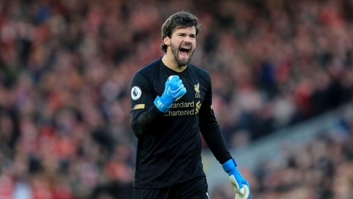 LIVERPOOL, ENGLAND - NOVEMBER 30: Alisson of Liverpool celebrates  during the Premier League match between Liverpool FC and Brighton & Hove Albion at Anfield on November 30, 2019 in Liverpool, United Kingdom. (Photo by Marc Atkins/Getty Images)