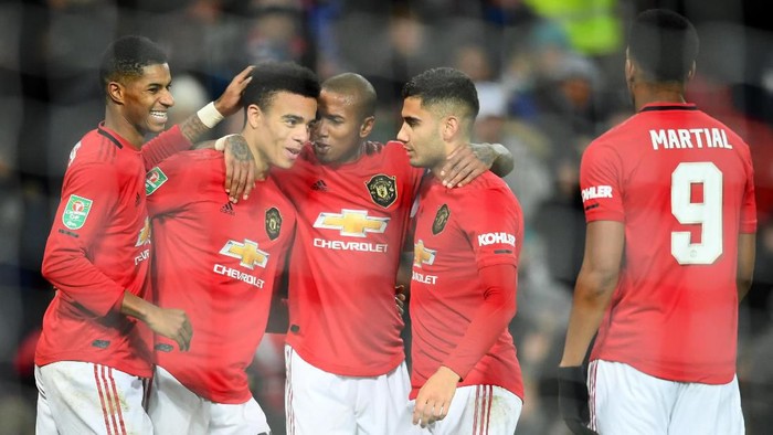 MANCHESTER, ENGLAND - DECEMBER 18: Marcus Rashford, Mason Greenwood, Ashley Young, Andreas Pereira and Anthony Martial of Manchester United celebrate after Ryan Jackson of Colchester United (not pictured) scored an own-goal which lead to the second goal for Manchester United during the Carabao Cup Quarter Final match between Manchester United and Colchester United at Old Trafford on December 18, 2019 in Manchester, England. (Photo by Clive Mason/Getty Images)