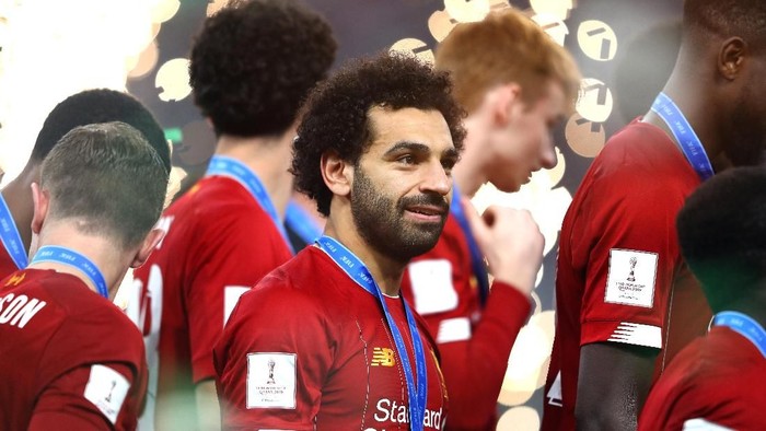 DOHA, QATAR - DECEMBER 21: Mohamed Salah of Liverpool looks on after receiving his winners meal during the trophy presentation following the FIFA Club World Cup Qatar 2019 Final between Liverpool FC and CR Flamengo at Education City Stadium on December 21, 2019 in Doha, Qatar. (Photo by Francois Nel/Getty Images)