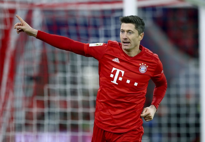 Bayerns Robert Lewandowski celebrates after scoring his sides fourth goal during the German Bundesliga soccer match between FC Bayern Munich and SV Werder Bremen in Munich, Germany, Saturday, Dec. 14, 2019. (AP Photo/Matthias Schrader)