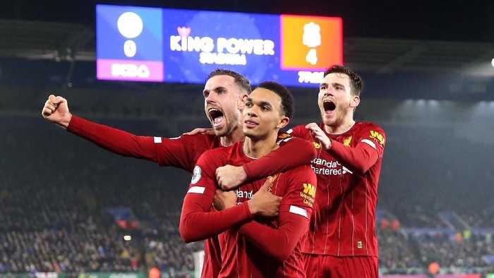 LEICESTER, ENGLAND - DECEMBER 26: Trent Alexander-Arnold of Liverpool celebrates scoring his sides fourth goal with Jordan Henderson and Andy Robertson  during the Premier League match between Leicester City and Liverpool FC at The King Power Stadium on December 26, 2019 in Leicester, United Kingdom. (Photo by Alex Pantling/Getty Images)