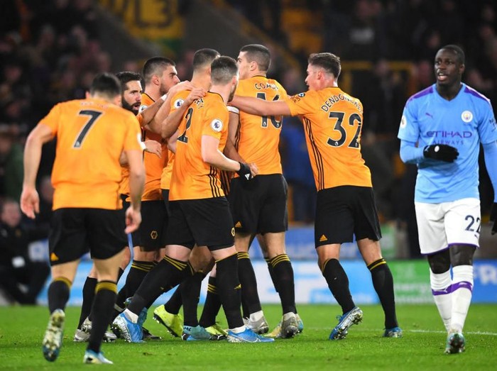 WOLVERHAMPTON, ENGLAND - DECEMBER 27: Benjamin Mendy of Manchester City reacts after Raul Jimenez of Wolverhampton Wanderers scores his sides second goal during the Premier League match between Wolverhampton Wanderers and Manchester City at Molineux on December 27, 2019 in Wolverhampton, United Kingdom. (Photo by Clive Mason/Getty Images)