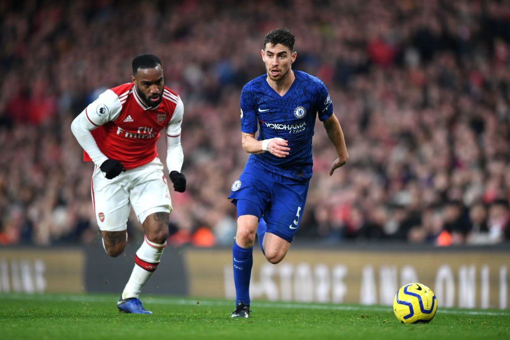 LONDON, ENGLAND - DECEMBER 29: Jorginho of Chelsea is closed down by Alexandre Lacazette of Arsenal  during the Premier League match between Arsenal FC and Chelsea FC at Emirates Stadium on December 29, 2019 in London, United Kingdom. (Photo by Shaun Botterill/Getty Images)