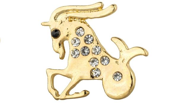 Woman zodiac brooches. Beautiful collection of brooches in the shape of the zodiac signs, gold with diamonds, isolated on white background, clipping paths included
