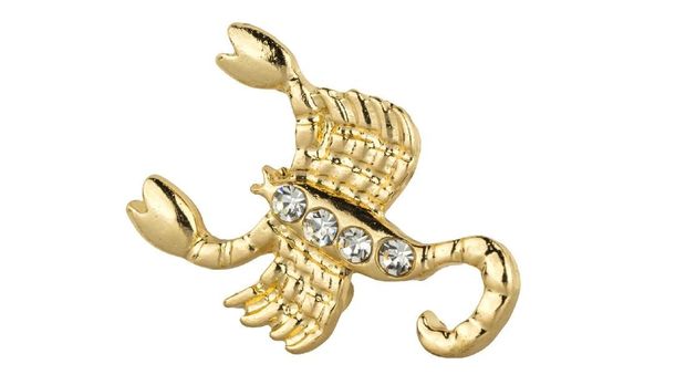 Woman zodiac brooches. Beautiful collection of brooches in the shape of the zodiac signs, gold with diamonds, isolated on white background, clipping paths included
