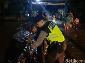 Sungai Meluap ke Permukiman, Ini yang Dilakukan Warga dan Polisi Pasuruan