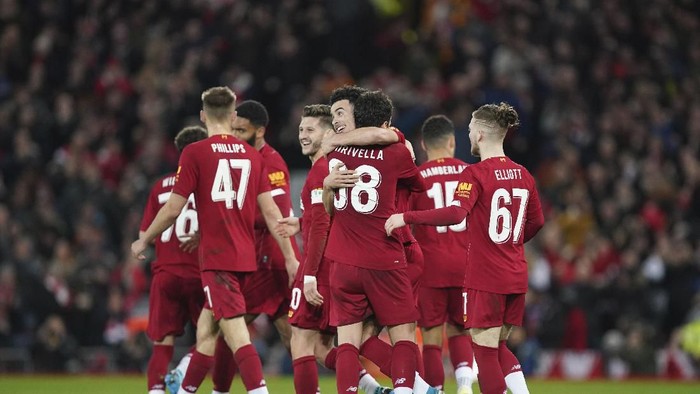 Liverpools Curtis Jones, fourth from right, celebrates with his teammates after scoring his sides opening goal during the English FA Cup third round soccer match between Liverpool and Everton at Anfield stadium in Liverpool, England, Sunday, Jan. 5, 2020. (AP Photo/Jon Super)