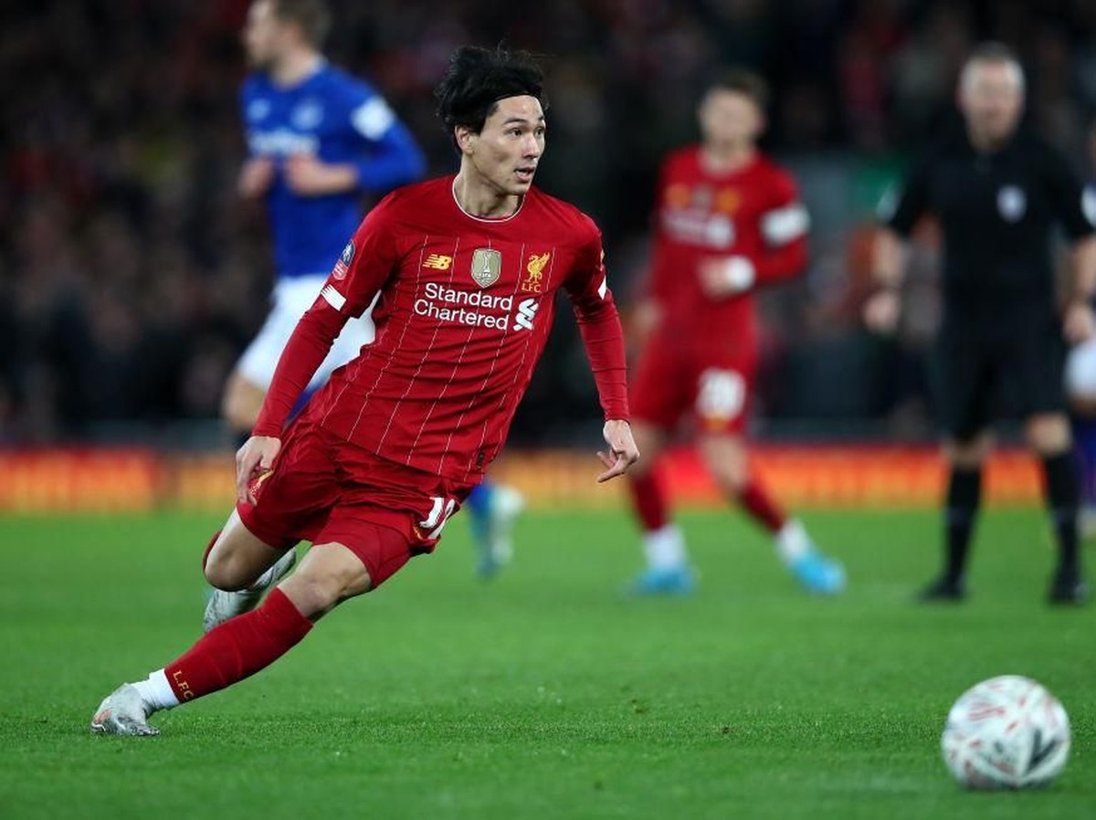 Minamino senang dengan kemenangan yang diraih Liverpool di laga debutnya. Foto: Clive Brunskill/Getty Images