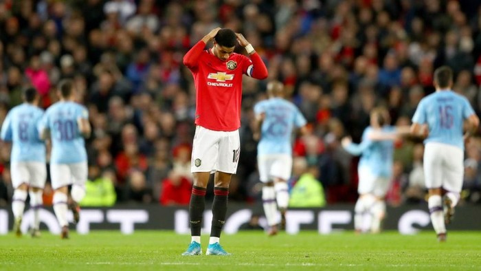MANCHESTER, ENGLAND - JANUARY 07: Marcus Rashford of Manchester United reacts to Manchester City scoring there third goal during the Carabao Cup Semi Final match between Manchester United and Manchester City at Old Trafford on January 07, 2020 in Manchester, England. (Photo by Michael Steele/Getty Images)