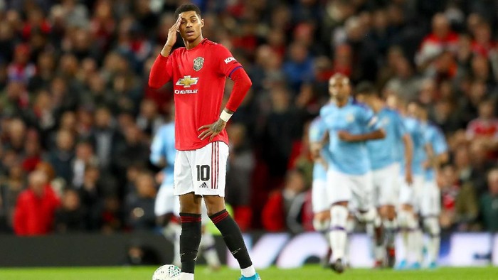 MANCHESTER, ENGLAND - JANUARY 07: Marcus Rashford of Manchester United reacts to Manchester City scoring there third goal during the Carabao Cup Semi Final match between Manchester United and Manchester City at Old Trafford on January 07, 2020 in Manchester, England. (Photo by Michael Steele/Getty Images)