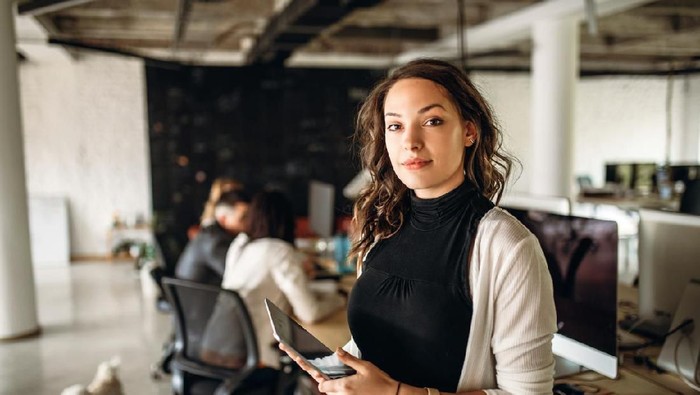 zodiak Group of young business people are working together in terbaru office. Creative people with laptop, tablet, smart phone, notebook. Successful hipster team in coworking. Freelancers.