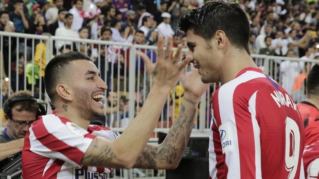 Atletico Madrid's Angel Correa, left, celebrates with Atletico Madrid's Alvaro Morata after scoring his side's third goal during the Spanish Super Cup semifinal soccer match between Barcelona and Atletico Madrid at King Abdullah stadium in Jiddah, Saudi Arabia, Thursday, Jan. 9, 2020. (AP Photo/Hassan Ammar)