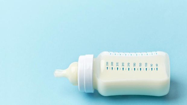 baby milk bottle on blue background