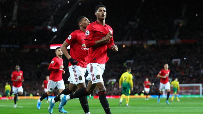 MANCHESTER, ENGLAND - JANUARY 11: Marcus Rashford of Manchester United celebrates after scoring his teams second goal during the Premier League match between Manchester United and Norwich City at Old Trafford on January 11, 2020 in Manchester, United Kingdom. (Photo by Catherine Ivill/Getty Images)