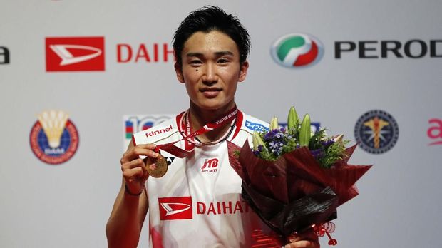 Japan's Kento Momota poses with his medal after defeating Denmark's Viktor Axelsen during men single final of the Malaysia Masters in Kuala Lumpur, Malaysia, Sunday, Jan. 12, 2020. (AP Photo/Kien Huo)