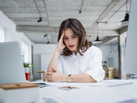 Confident couple trying to manage domestic finances, calculating and making notes