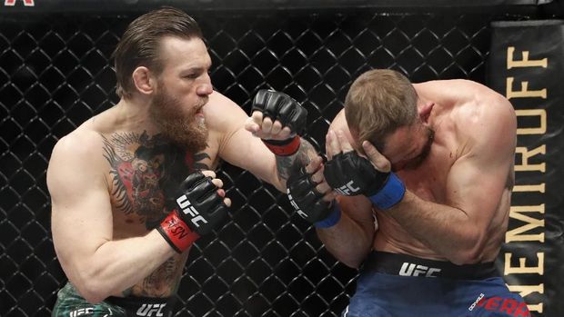 Conor McGregor, left, fights Donald 