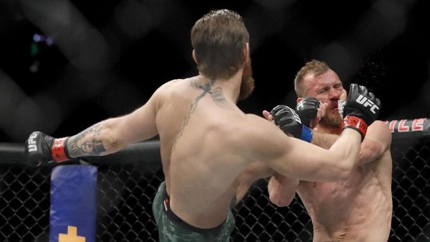 LAS VEGAS, NEVADA - JANUARY 18: Conor McGregor lands a kick to the face of Donald Cerrone in the first round in a welterweight bout during UFC246 at T-Mobile Arena on January 18, 2020 in Las Vegas, Nevada.   Steve Marcus/Getty Images/AFP