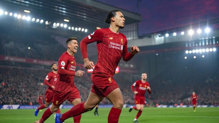 LIVERPOOL, ENGLAND - JANUARY 19: Virgil van Dijk of Liverpool celebrates scoring to make it 1-0 during the Premier League match between Liverpool FC and Manchester United at Anfield on January 19, 2020 in Liverpool, United Kingdom. (Photo by Michael Regan/Getty Images)