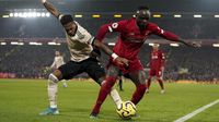 Liverpools Sadio Mane, right, and Manchester Uniteds Fred challenge for the ball during the English Premier League soccer match between Liverpool and Manchester United at Anfield Stadium in Liverpool, Sunday, Jan. 19, 2020.(AP Photo/Jon Super)\