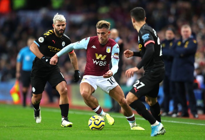 BIRMINGHAM, ENGLAND - JANUARY 12: Jack Grealish of Aston Villa takes on Joao Cancelo of Manchester City during the Premier League match between Aston Villa and Manchester City at Villa Park on January 12, 2020 in Birmingham, United Kingdom. (Photo by Catherine Ivill/Getty Images)